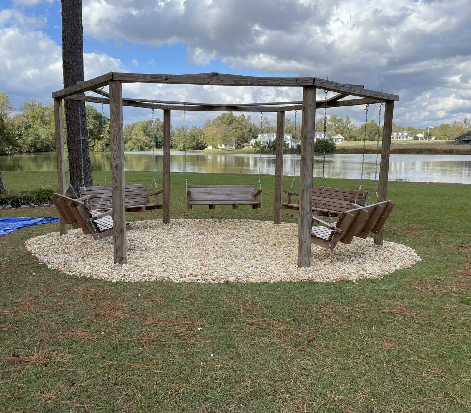 New wood structure with swinging benches